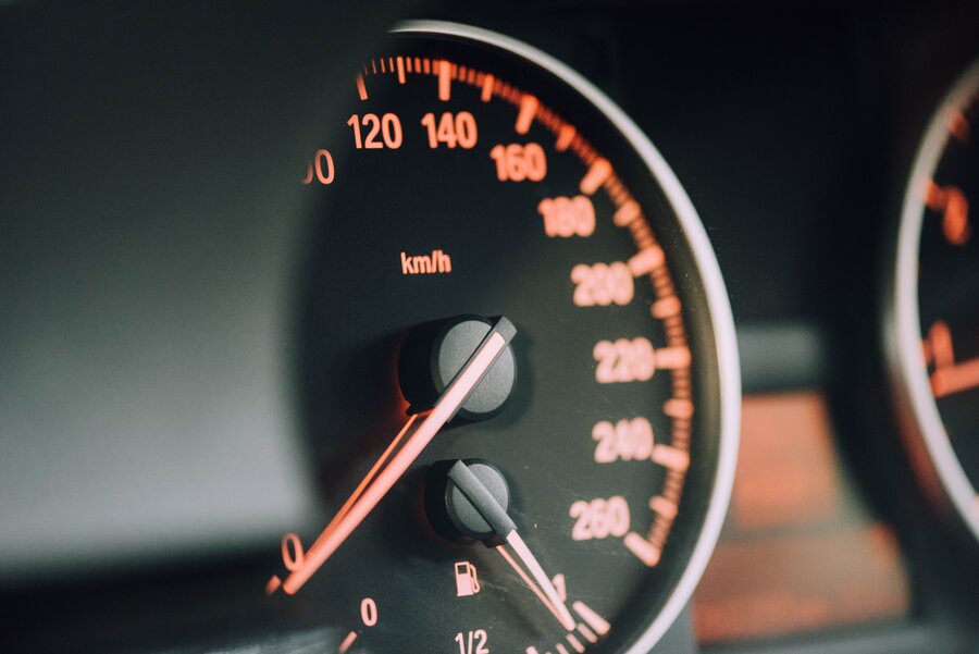 A car’s speedometer in closeup view.