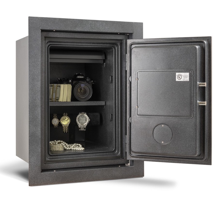 Wall safe shown partially open with watches and a camera stored securely inside