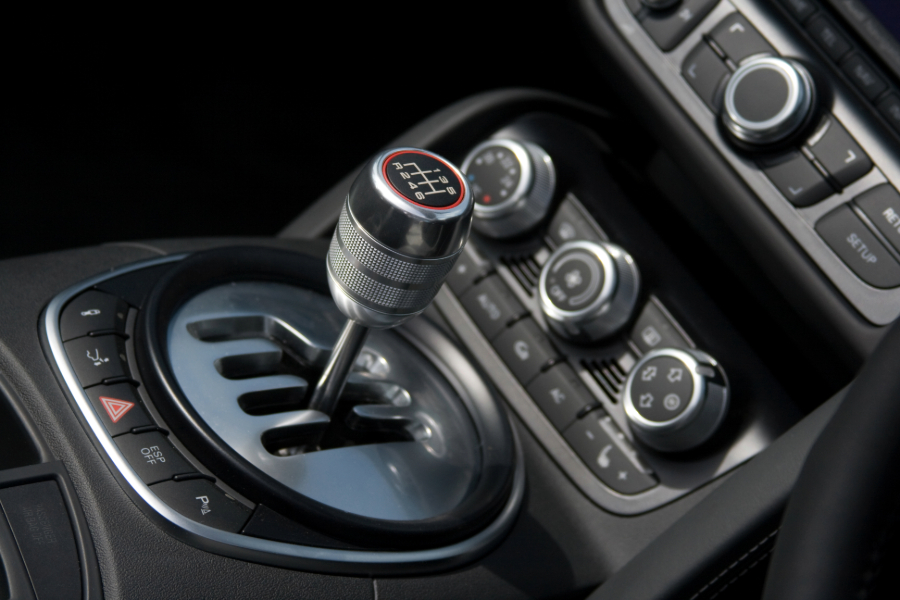 Close-up of a car's gear stick and shift knob, showcasing the interior design of the vehicle.