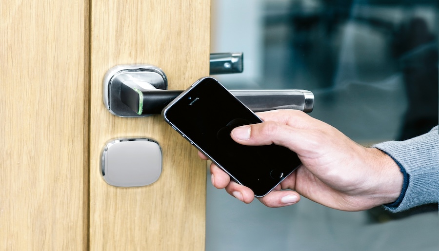 Mobile device being used as an access control tool on a door knob.